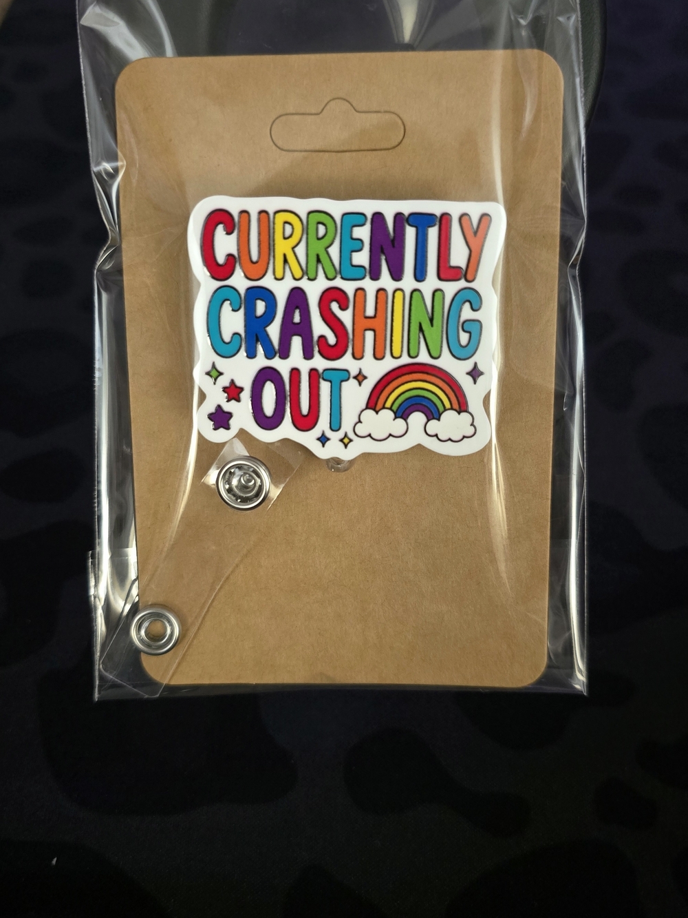 Crashing Out Rainbow Novelty Badge Reel